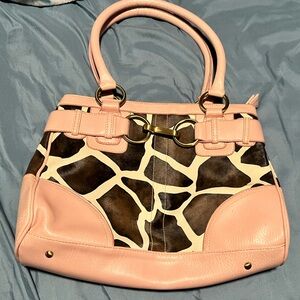 Cute purse, giraffe or cow print with pink no tags never used.